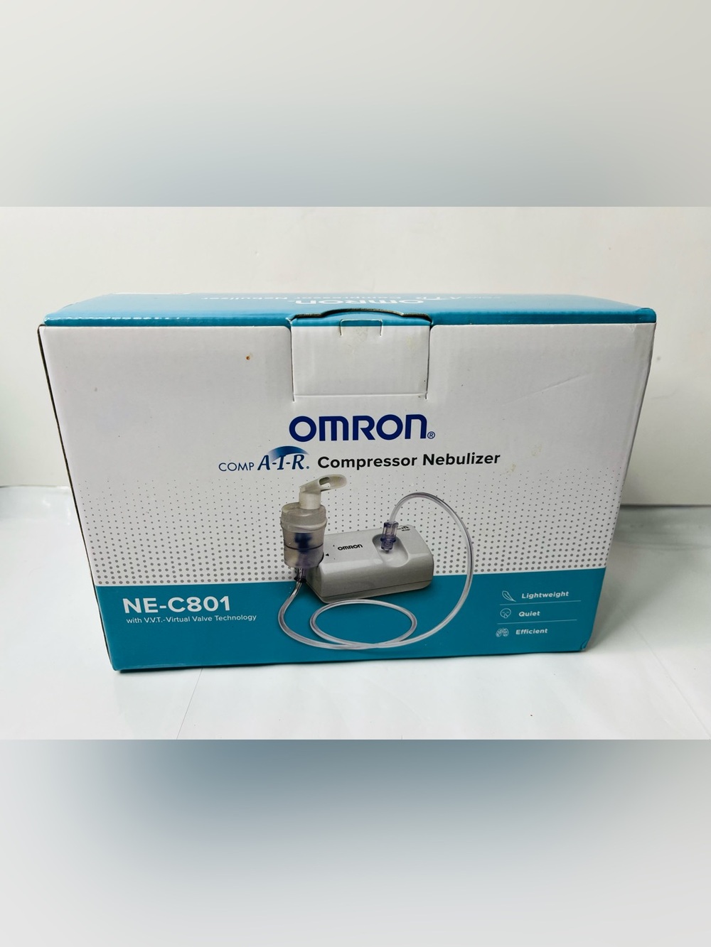 OMRON White and Teal Compressor